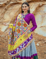 This stunning multi-color lehenga and complementing purple choli...