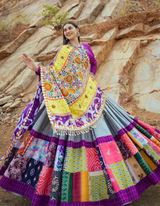 This stunning multi-color lehenga and complementing purple choli...