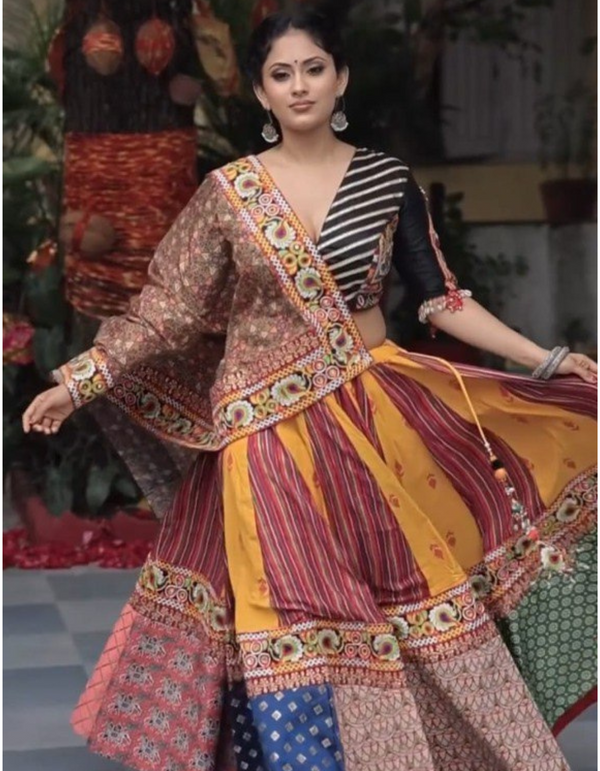 This stunning yellow and maroon lehenga paired effortlessly with a sleek black choli