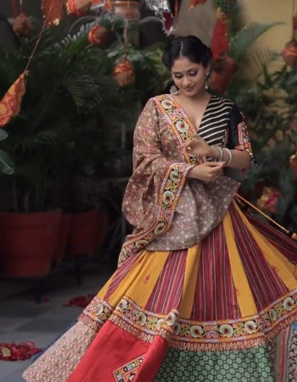 This stunning yellow and maroon lehenga paired effortlessly with a sleek black choli