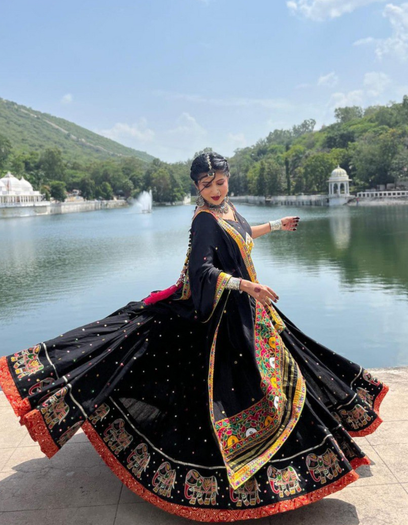 Black lehenga and matching choli, adorned with a matching dupatta