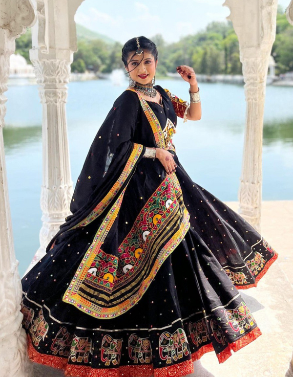 Black lehenga and matching choli, adorned with a matching dupatta