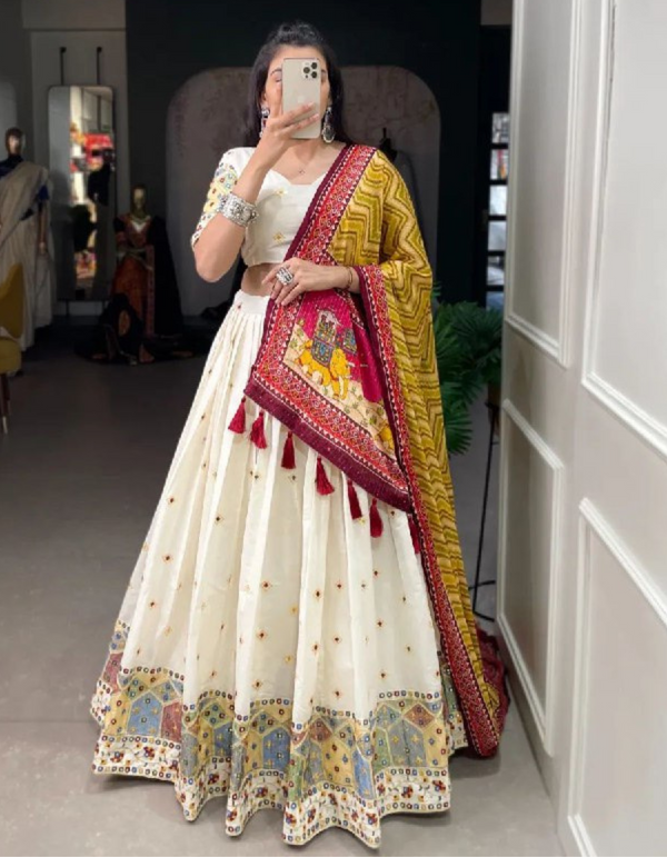 White lehenga and choli ensemble, adorned with a matching dupatta