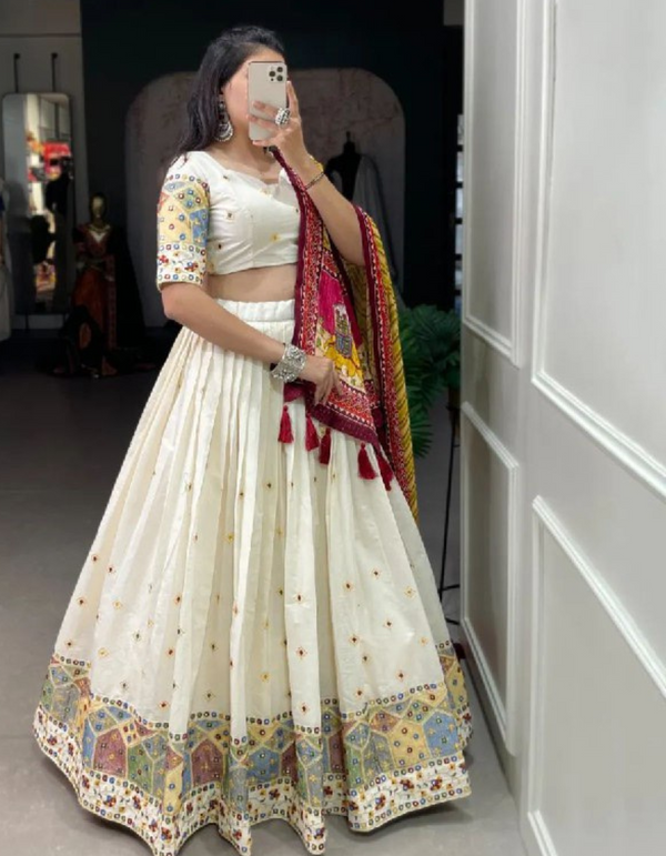 White lehenga and choli ensemble, adorned with a matching dupatta