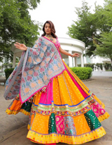 Pink and yellow lehenga, paired with a matching pink choli and a beautifully printed dupatta