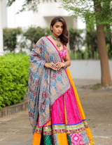 Pink and yellow lehenga, paired with a matching pink choli and a beautifully printed dupatta