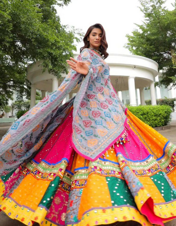 Pink and yellow lehenga, paired with a matching pink choli and a beautifully printed dupatta