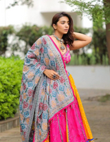 Pink and yellow lehenga, paired with a matching pink choli and a beautifully printed dupatta