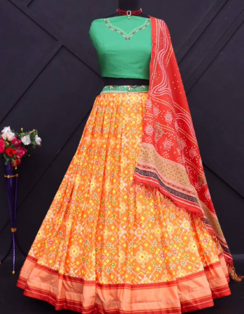 Yellow lehenga paired with a bold green choli and complemented by a striking red dupatta