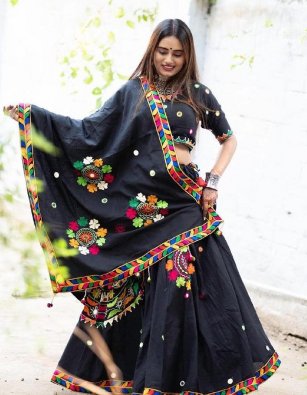 Black lehenga and choli ensemble, adorned with a matching black dupatta