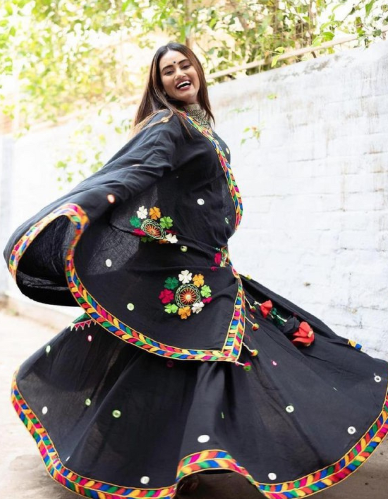 Black lehenga and choli ensemble, adorned with a matching black dupatta