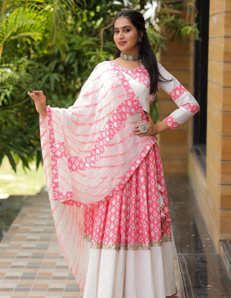 This white and pink lehenga choli ensemble with matching dupatta