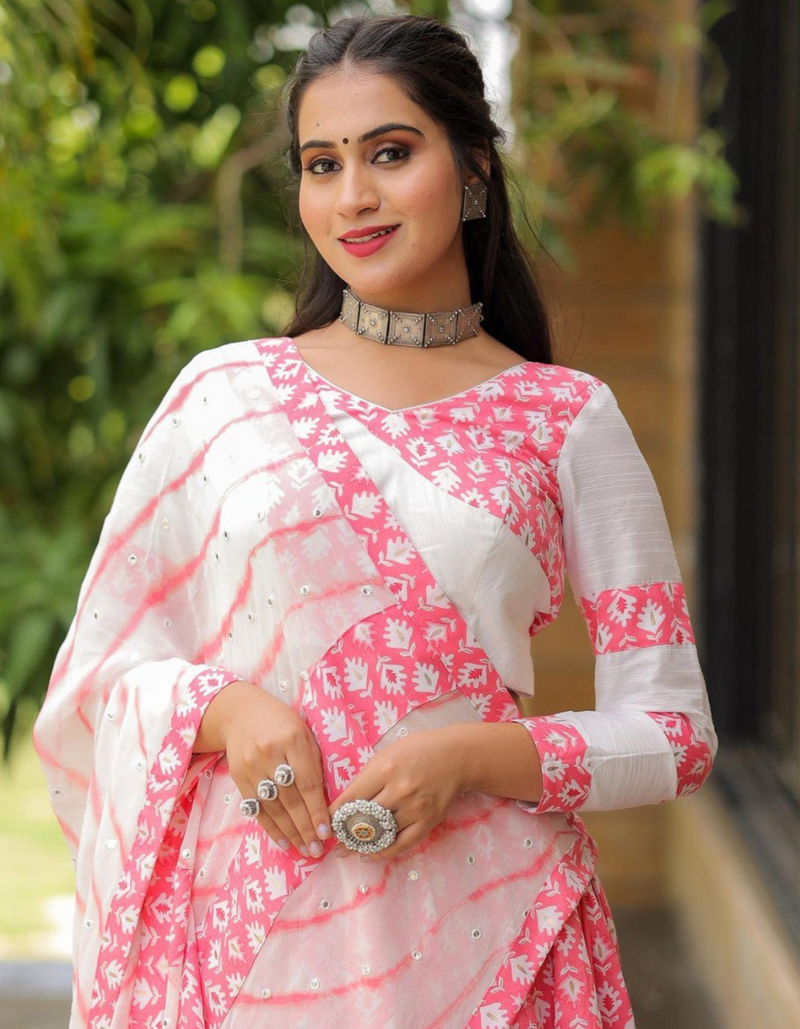 This white and pink lehenga choli ensemble with matching dupatta