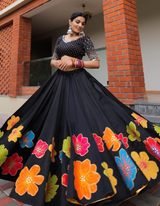 Black and multi-color floral lehenga choli ensemble, paired with a graceful black dupatta