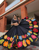 Black and multi-color floral lehenga choli ensemble, paired with a graceful black dupatta