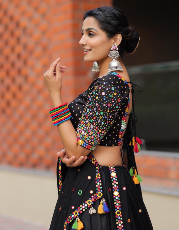 Black and multi-color floral lehenga choli ensemble, paired with a graceful black dupatta