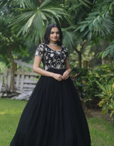 Elegance with this stunning black gown featuring intricate embroidery..