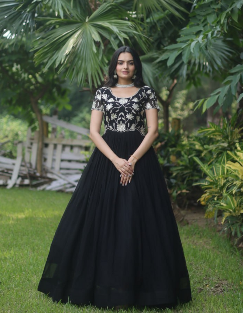 Elegance with this stunning black gown featuring intricate embroidery..