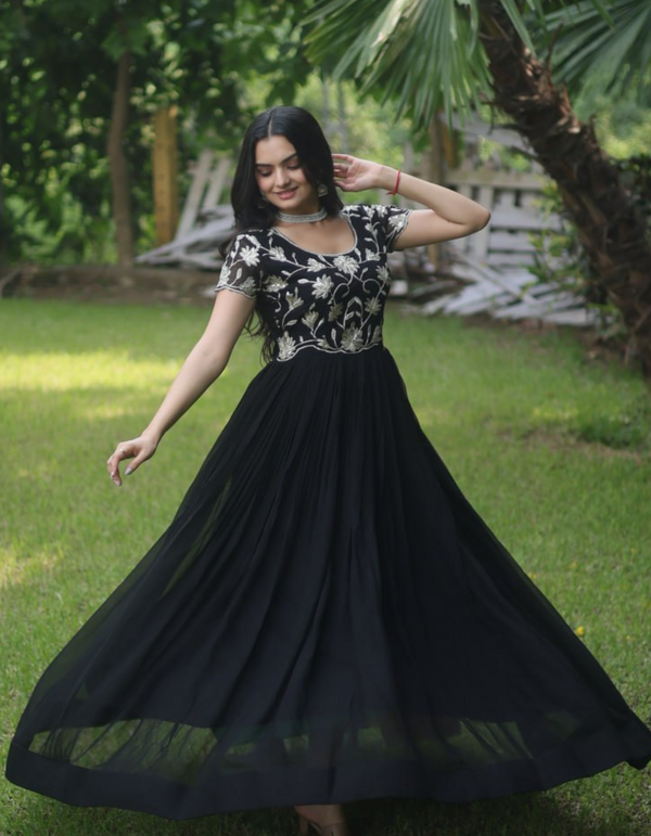 Elegance with this stunning black gown featuring intricate embroidery..