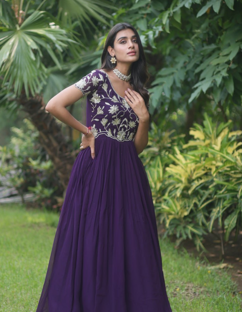 Captivating in shades of blue! This embroidered gown embodies elegance and sophistication