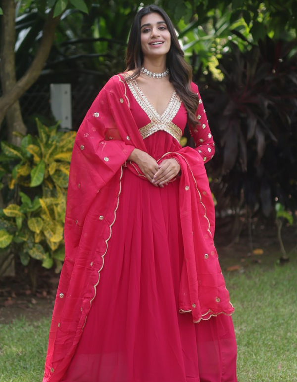 Step into timeless elegance with this exquisite pink embroidered gown.