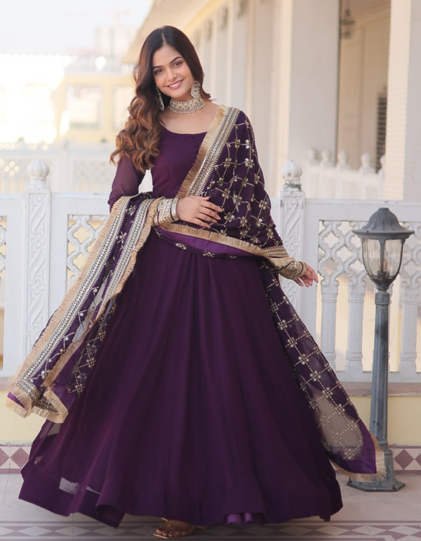 Regal elegance with this exquisite purple gown, complemented by a dupatta