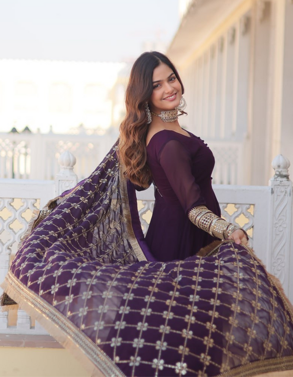 Regal elegance with this exquisite purple gown, complemented by a dupatta