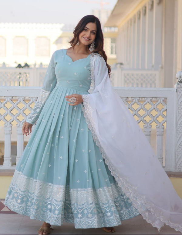 legance with this sky blue gown adorned with intricate embroidery, complemented