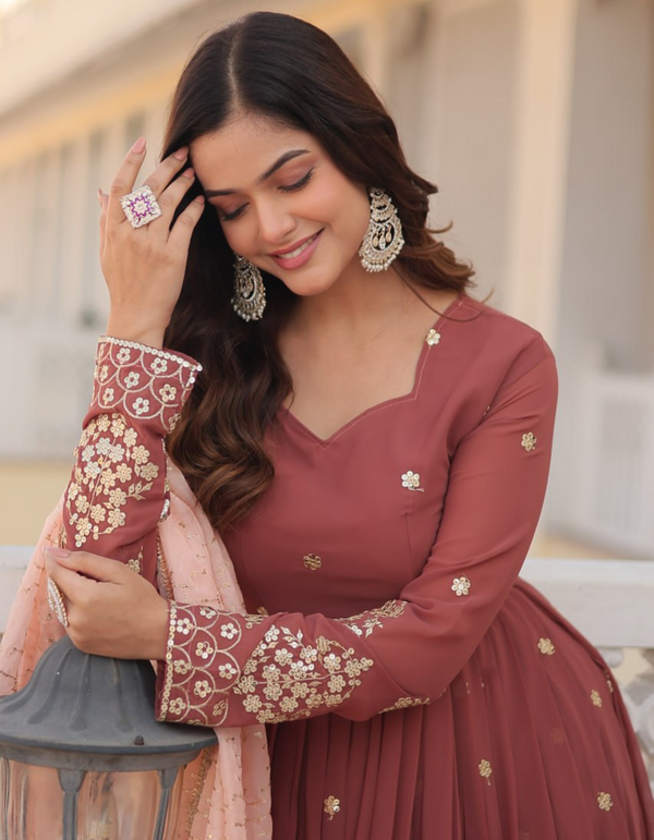 Drape yourself in timeless maroon elegance,  light pink dupatta for a touch of grace