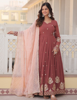 Drape yourself in timeless maroon elegance,  light pink dupatta for a touch of grace