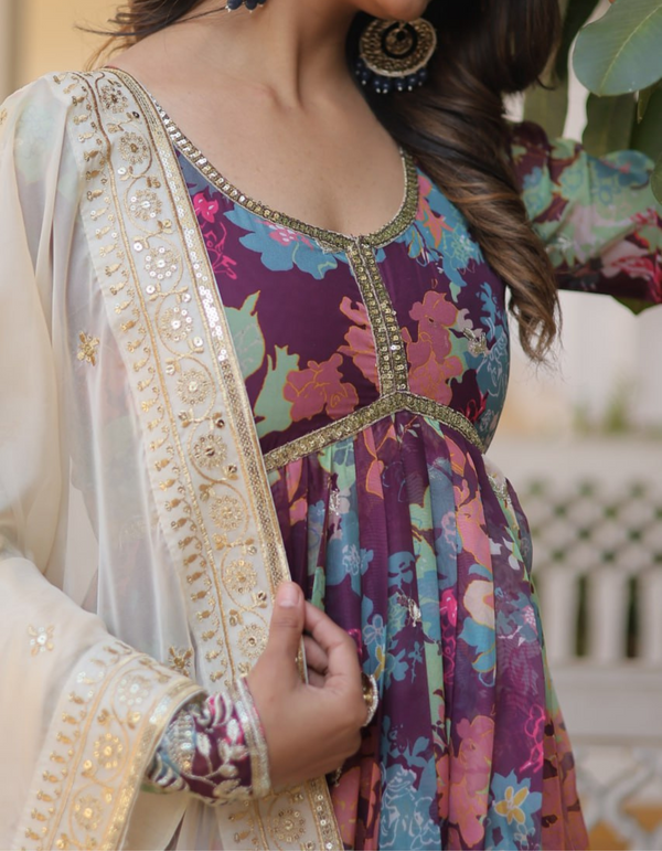 Embrace sophistication with a printed gown adorned with intricate embroidery