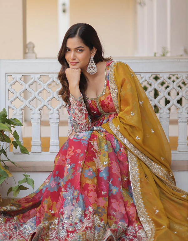 Brighten your day with a printed gown adorned with intricate embroidery