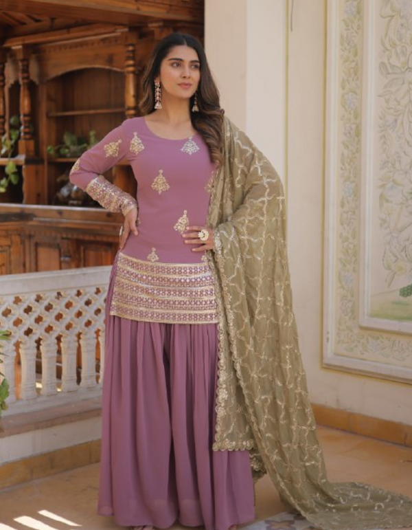 Delicate hues meet intricate craftsmanship in this light pink suit with a stunning cream-colored embroidered dupatta