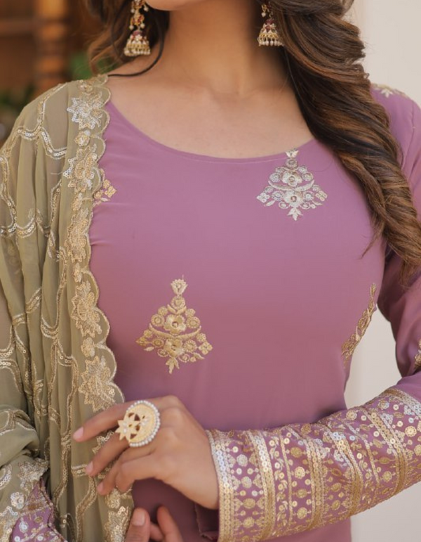 Delicate hues meet intricate craftsmanship in this light pink suit with a stunning cream-colored embroidered dupatta