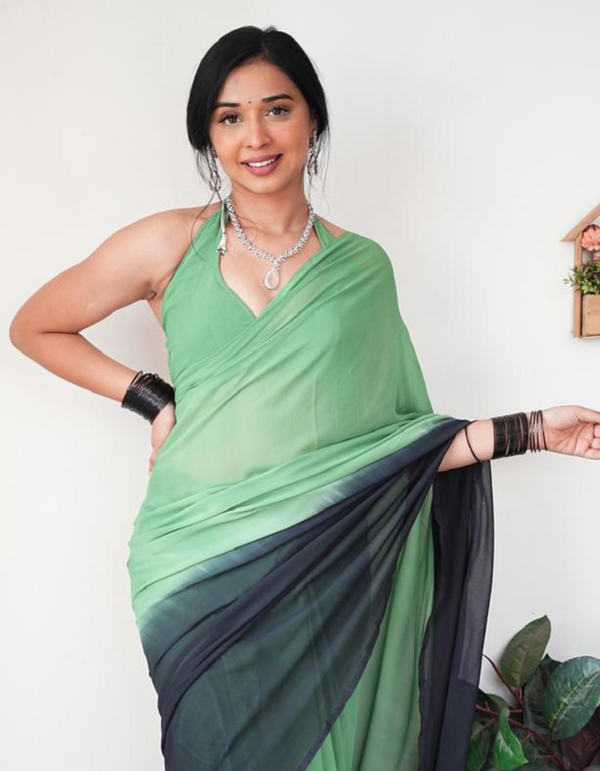 Embrace the striking contrast of green and black in this ready-to-wear saree.