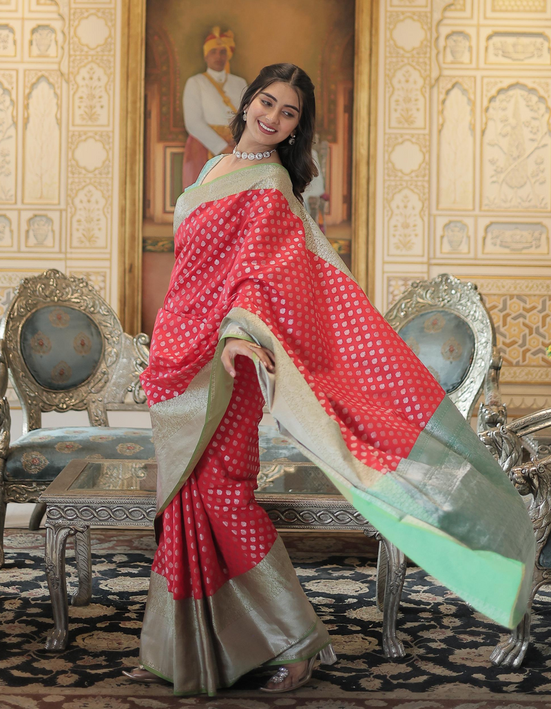 palette of light red, sky blue, and grey, woven into graceful sarees