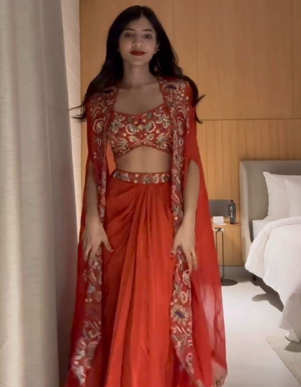 red three-piece suit with intricate embroidery